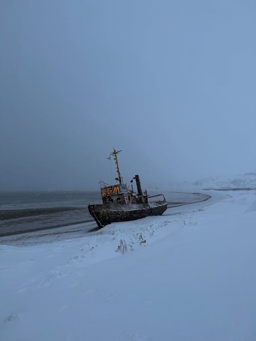 Boat on Snowy Shore 