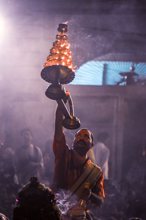 Free A spiritual Hindu ceremony with a man holding a lit lamp during Ganga Aarti in Varanasi, India. Stock Photo