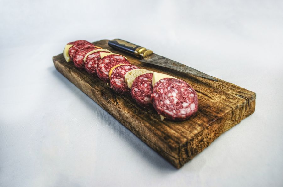 Salami board with a knife