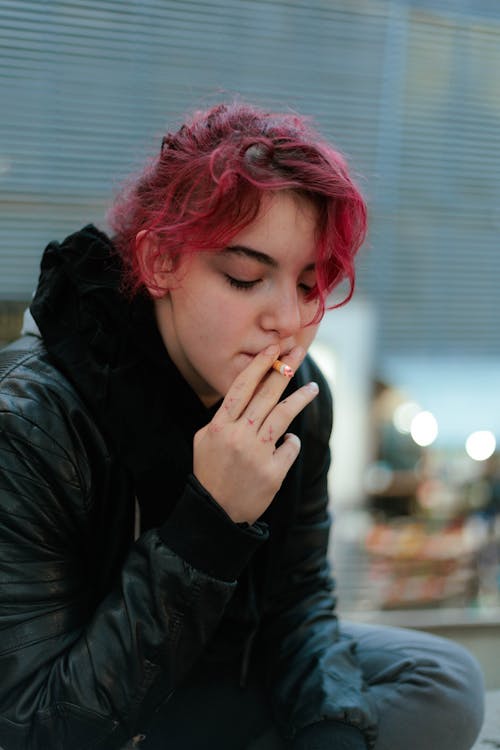 Redhead Woman Smoking Cigarette