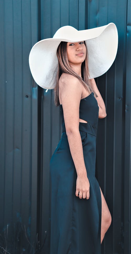 Woman in Black Dress and Wide White Brim Hat