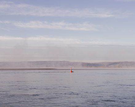 Red Navigational Buoy in Sea