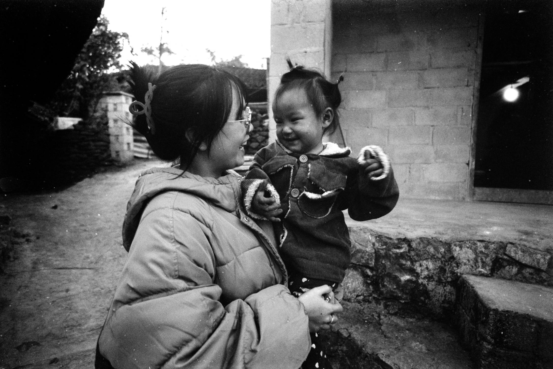 Mother In Jacket Holding Daughter Free Stock Photo mother-in-jacket-holding-daughter-free-stock-photo