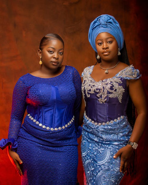 Two Models in Elegant Blue Dresses