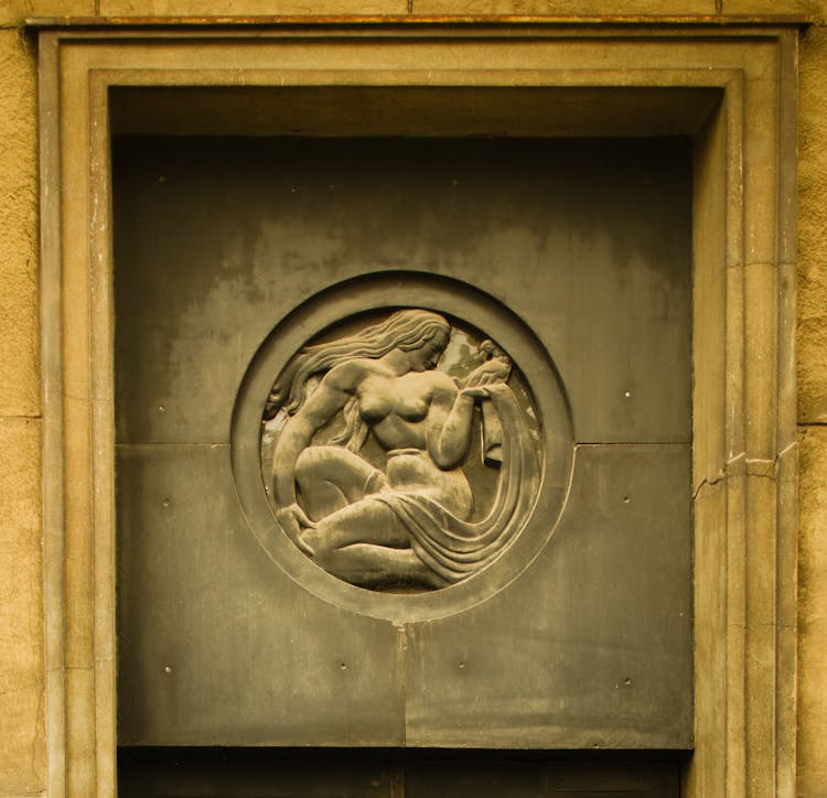 Architectural Detail With A Woman Bass Relief In A Circle