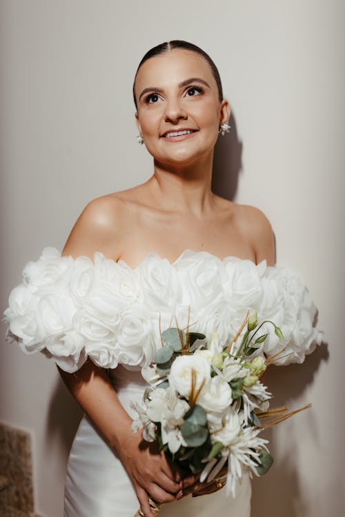 Bride Holding a Bouquet and Smiling 