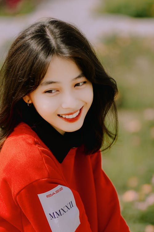 Young Smiling Model in Red Sweater