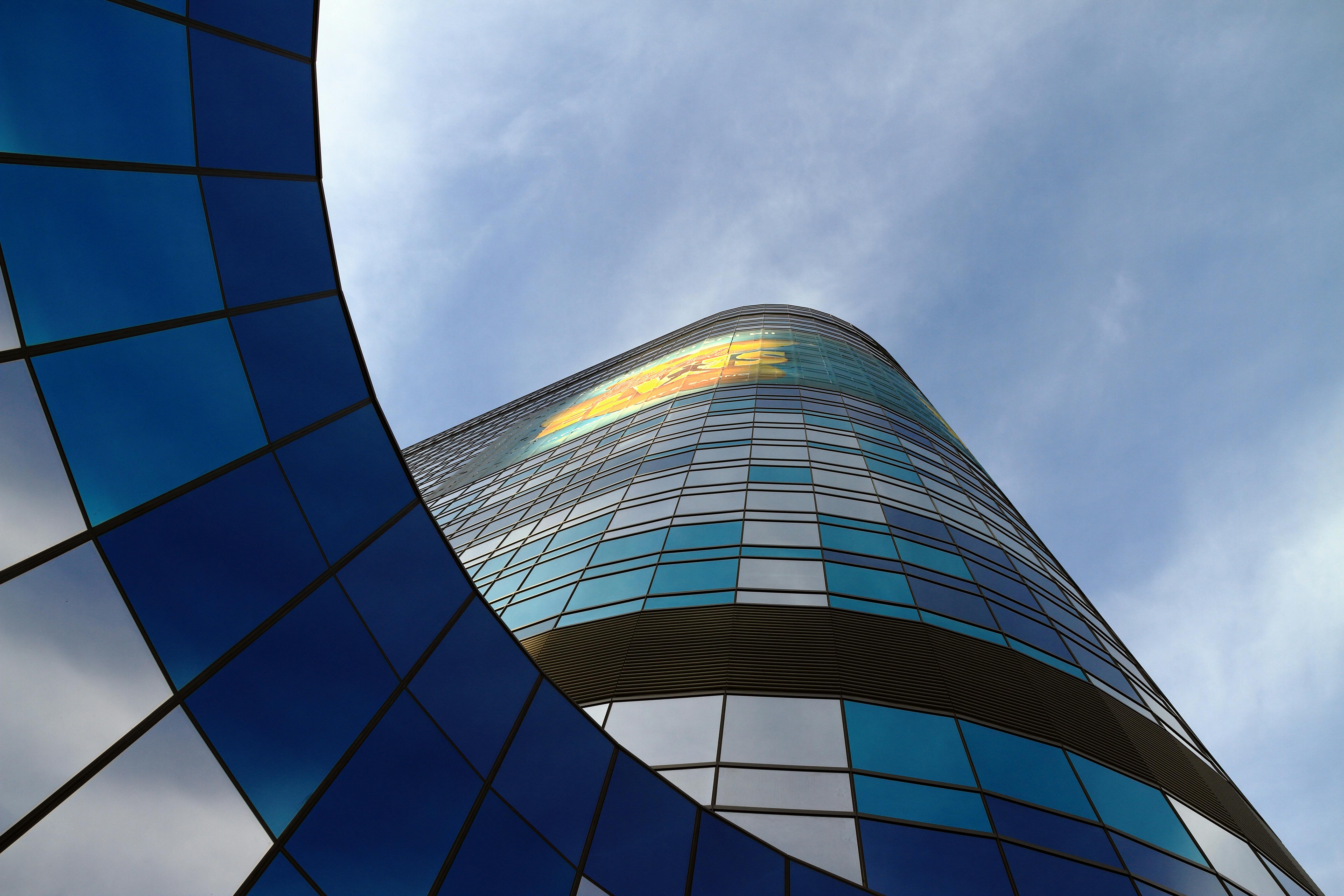 Futuristic skyscraper view in Las Vegas showcasing sleek modern architecture under a blue sky.