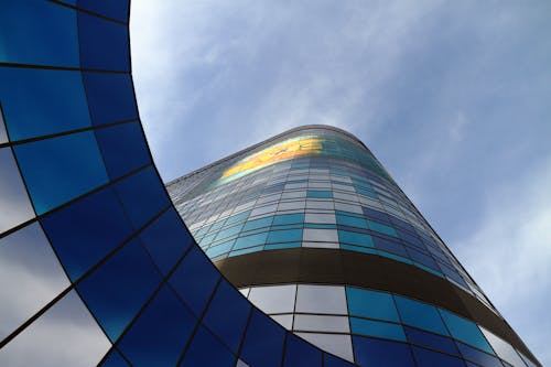 Low Angle Shot of a Modern Skyscraper under Blue Sky 