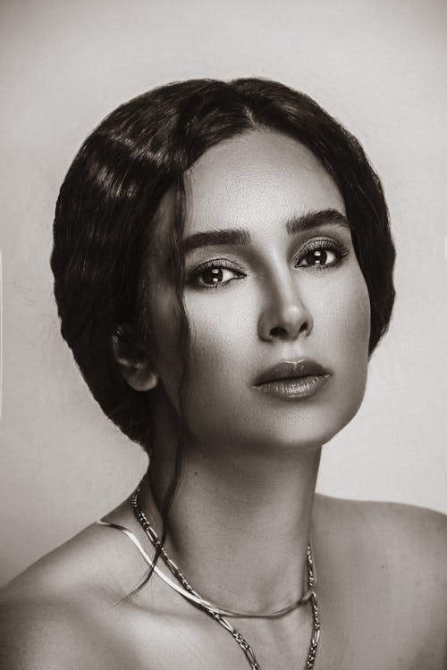 Black and White Portrait of a Beautiful Woman Wearing Necklaces 