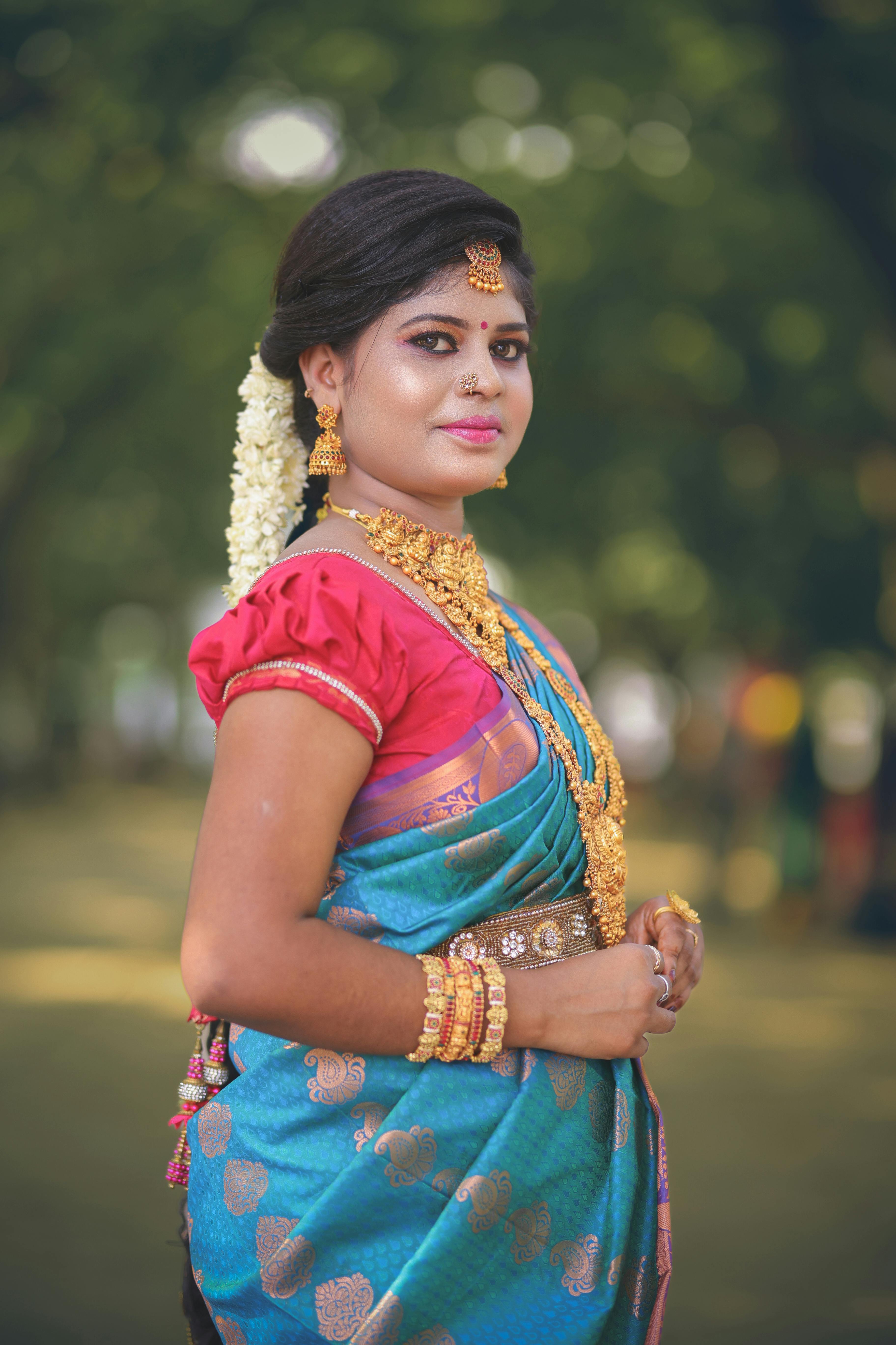 Smiling woman in a traditional indian wedding dress free stock photo