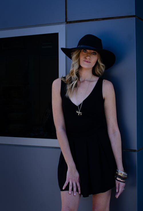 Blonde Woman Wearing Black Dress and Hat 
