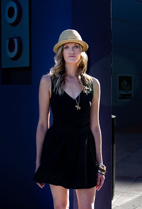 Blonde Woman Wearing Straw Hat and Black Dress