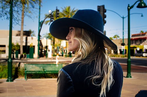 Blonde Woman Wearing Hat on a Square 