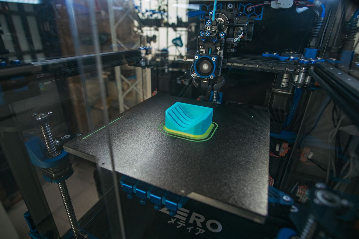 Stock photograph of a fused-filament 3D printer in operation