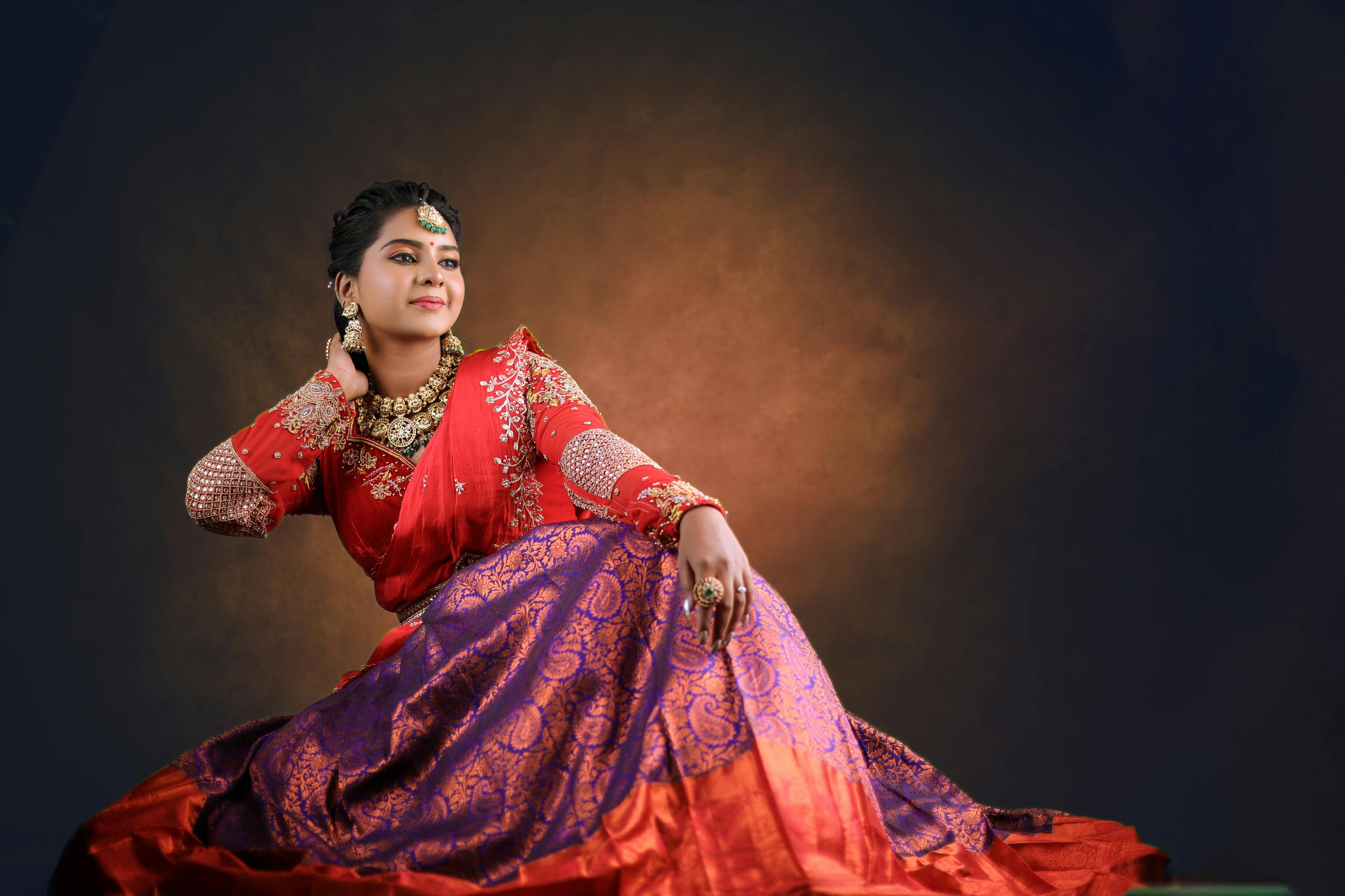 a woman in traditional sari poses for a portrait. AI-Generated 31542273  Stock Photo at Vecteezy