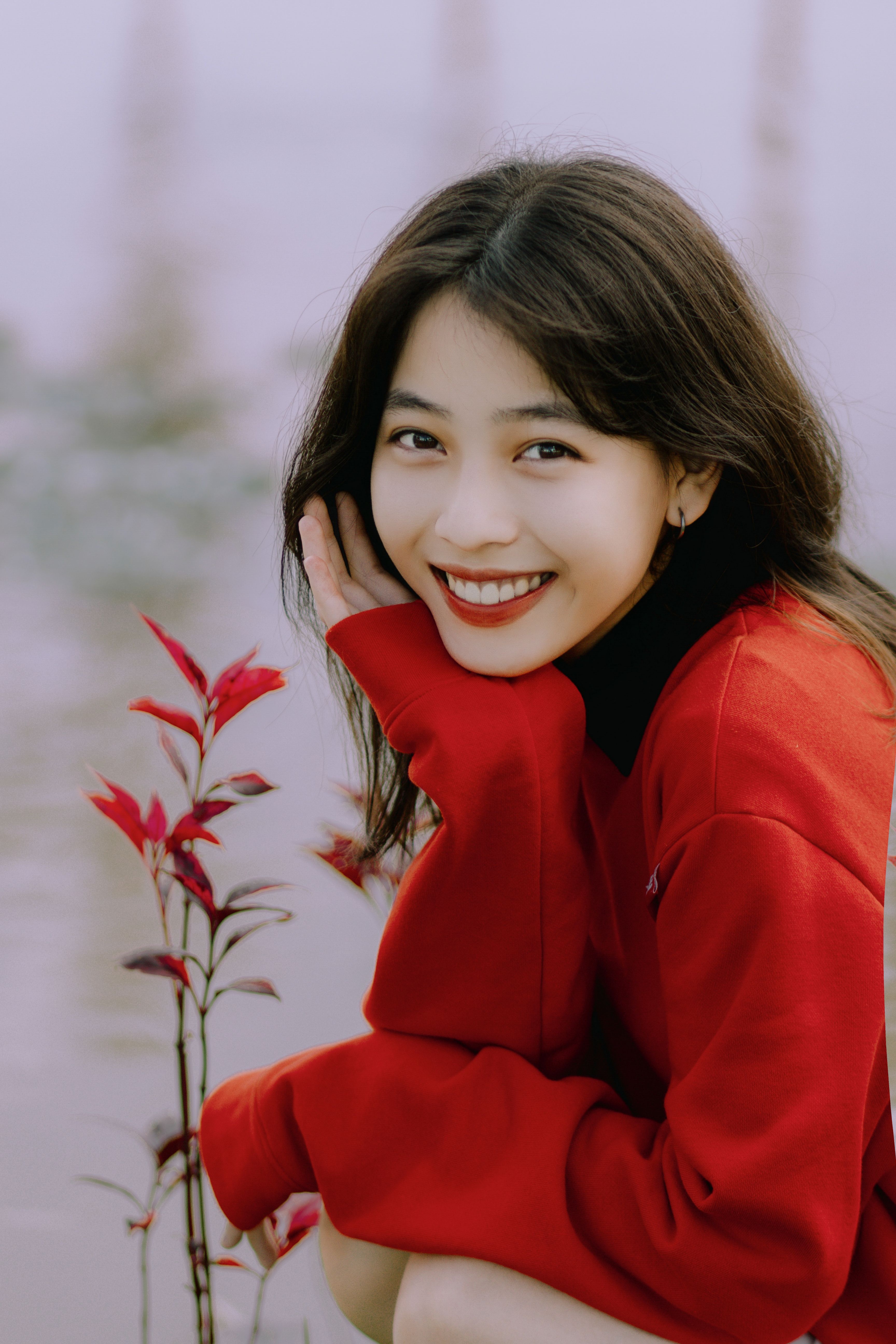 Smiling Woman in Red Clothes and with Black Hair · Free Stock Photo