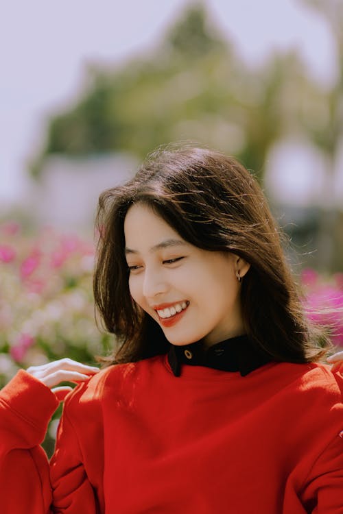Portrait of Smiling Woman in Red Clothes