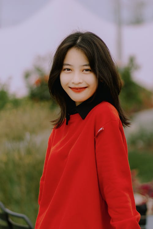 Portrait of Smiling Woman in Red Clothes