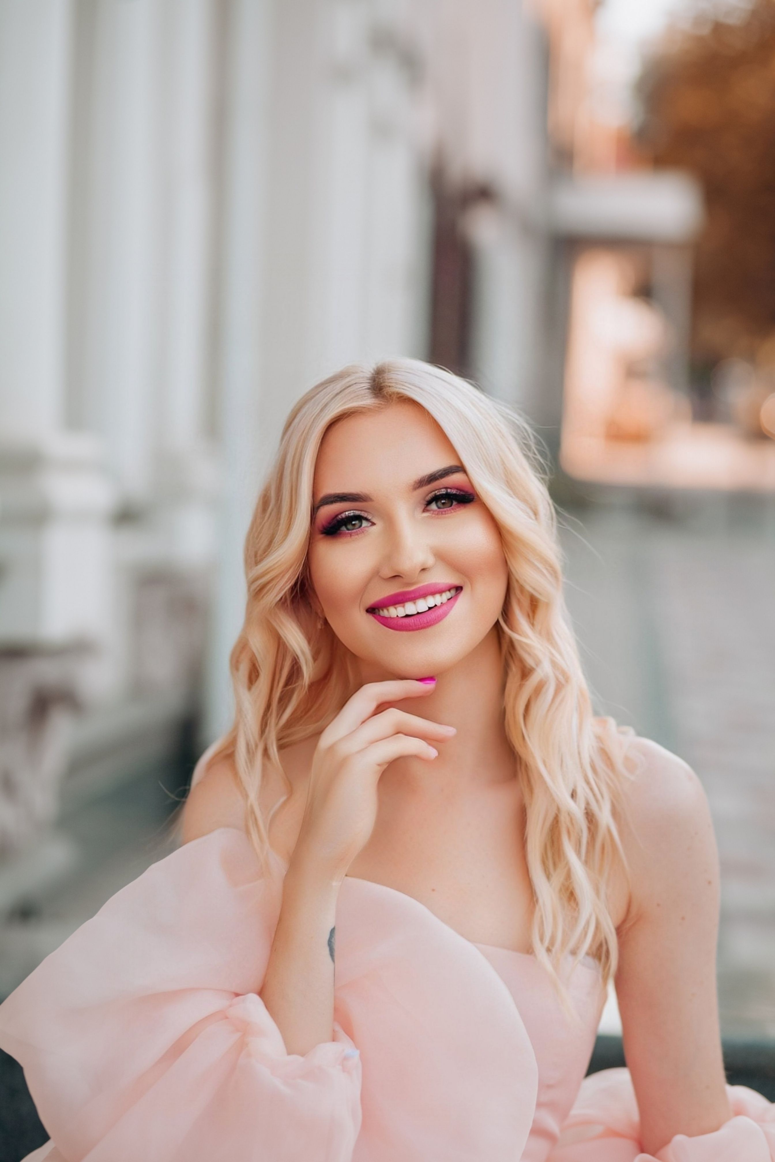 A beautiful blonde woman in a pink dress  Free Stock Photo