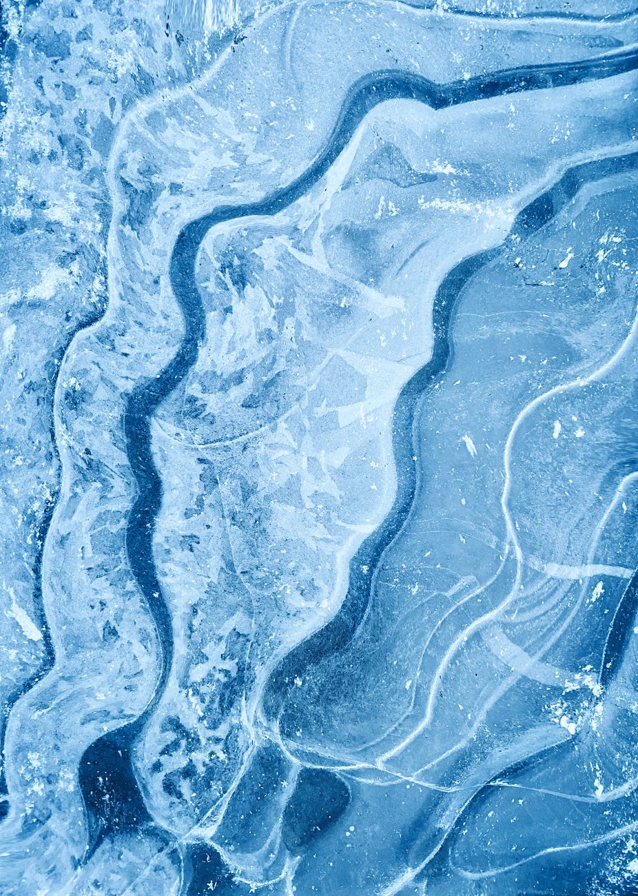Close-up of abstract blue ice with intricate layers and frozen patterns.. close, abstract, blue