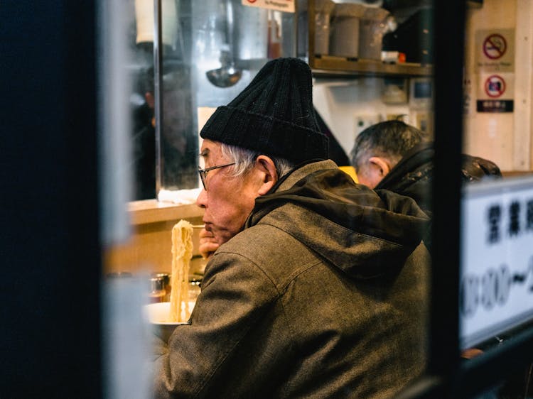 Man Eating Noodles