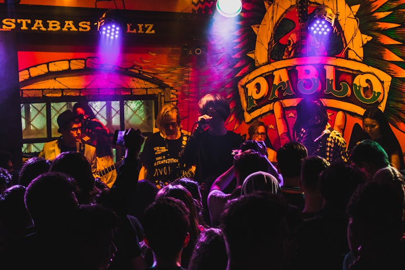 Live band performing in colorful club atmosphere