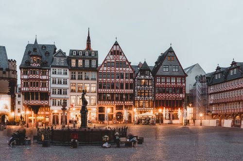 Free Quaint Römer Square in Frankfurt showcasing traditional half-timbered houses at dusk. Stock Photo