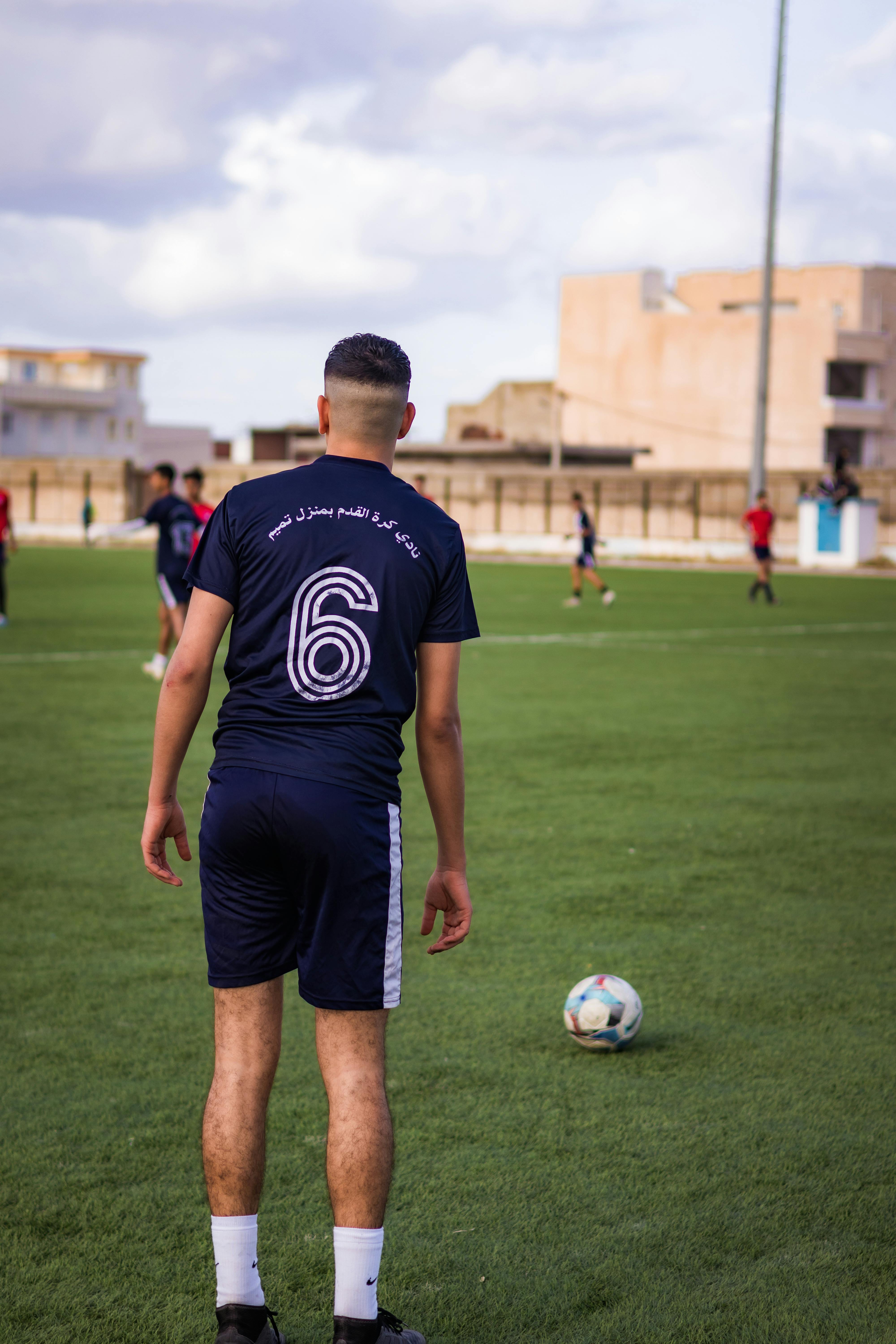 soccer player preparing to kick the ball