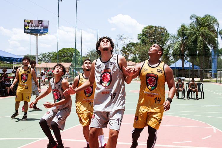 Young Men Playing Basketball