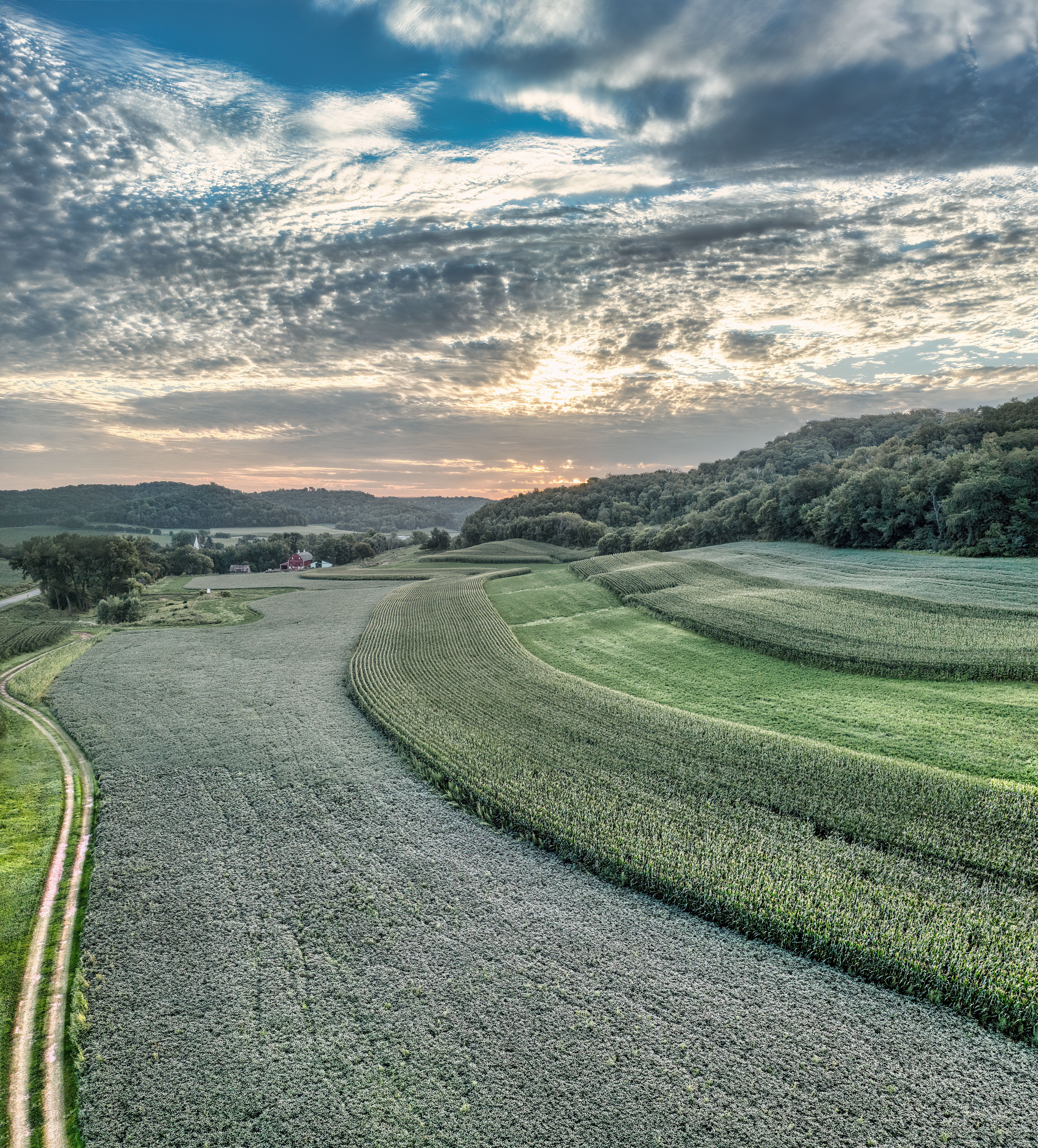 A stunning rural landscape in Nelson, WI, showcasing fields under a vivid sunset sky.