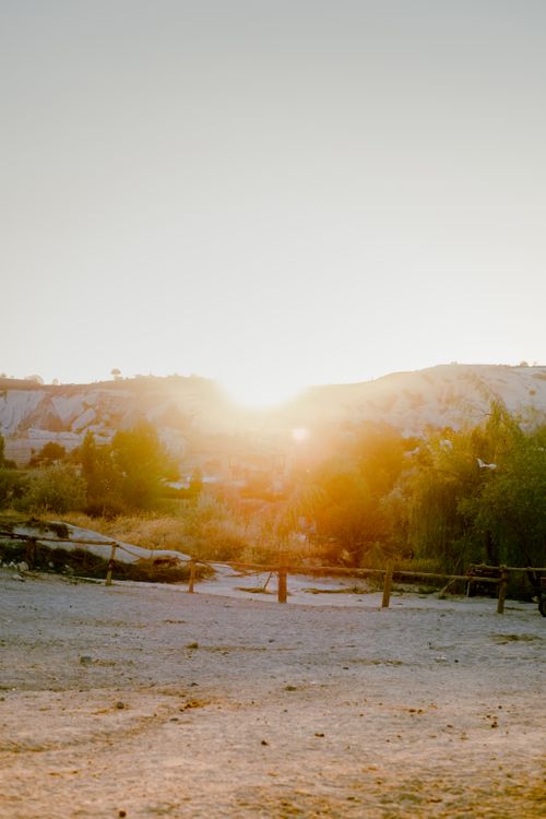 Free Sunset view of Göreme's unique landscapes in Cappadocia, Türkiye, highlighting its natural beauty. Stock Photo