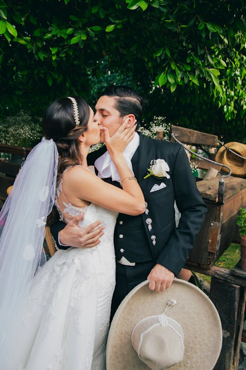 Newlyweds Kissing and Hugging