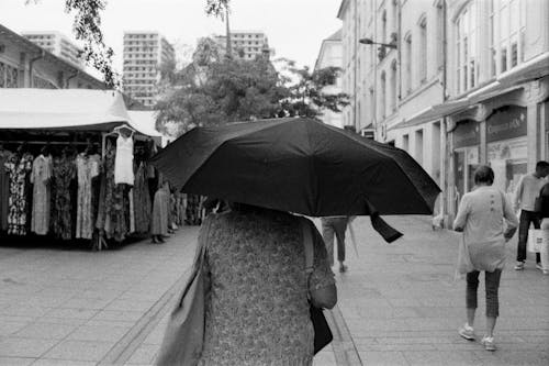 Woman with Umbrella on Street