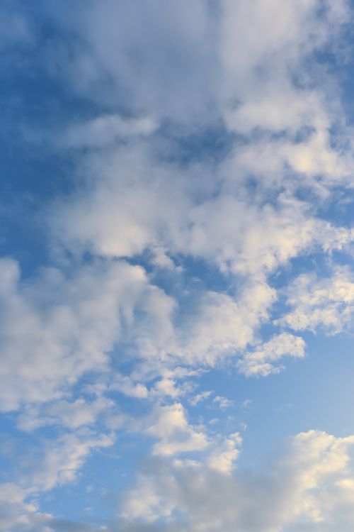 Free Serene cloudy sky with soft white clouds over Patna, India. Stock Photo