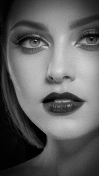 Elegant black and white close-up portrait capturing the beauty and depth of a woman's expression.