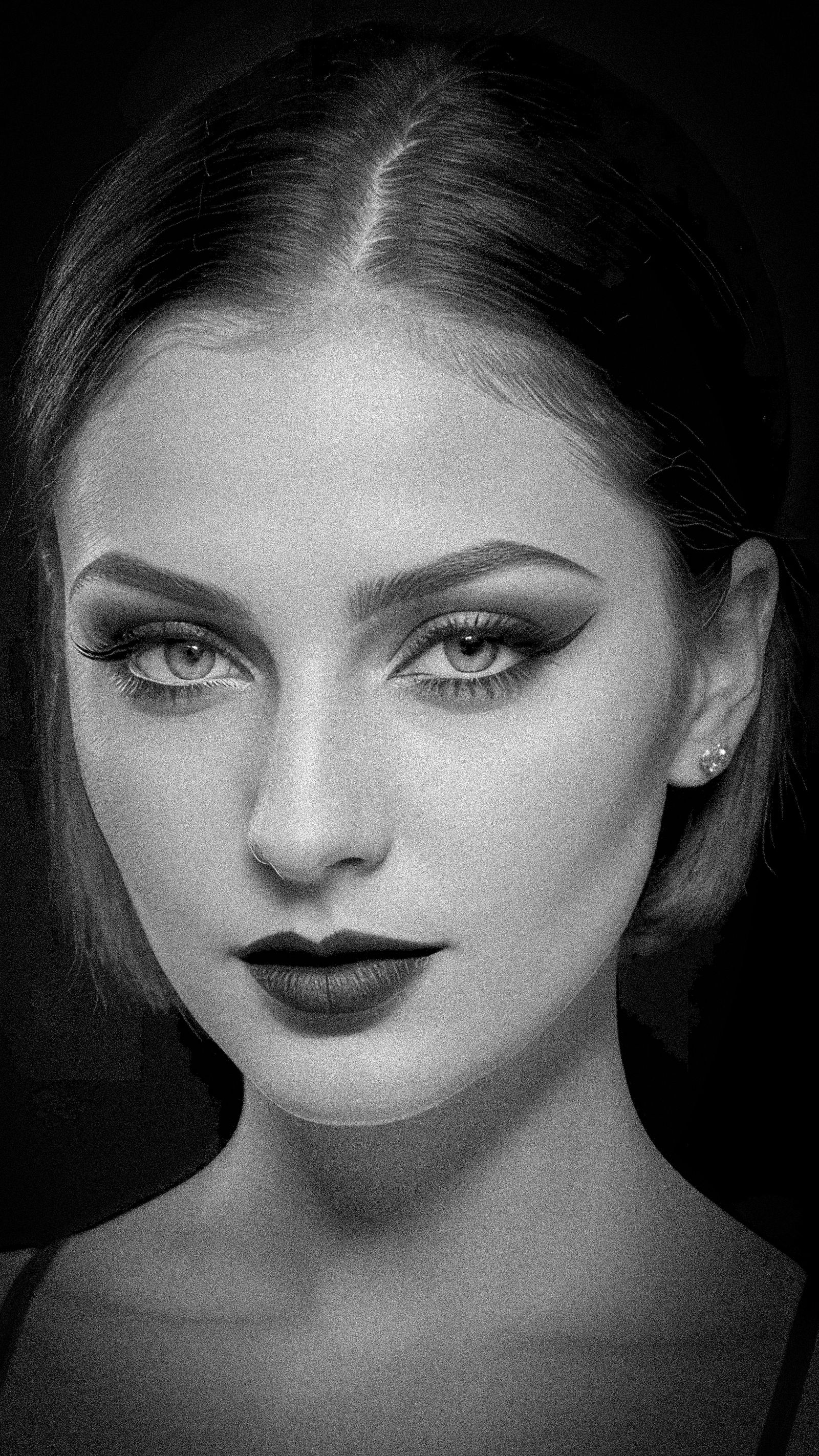 Striking black-and-white studio portrait of a woman