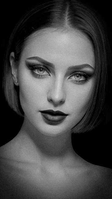 Stunning black and white portrait of a woman with striking features.