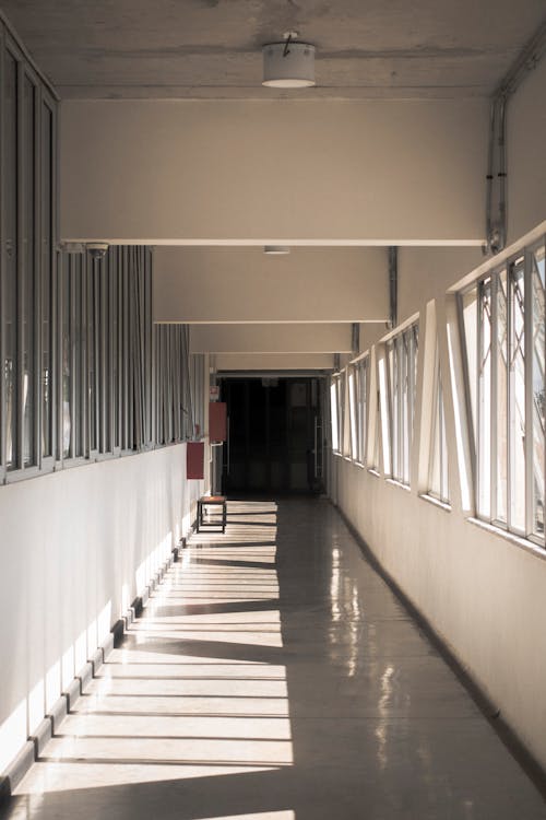 Empty Corridor with Gray Floor and Bench