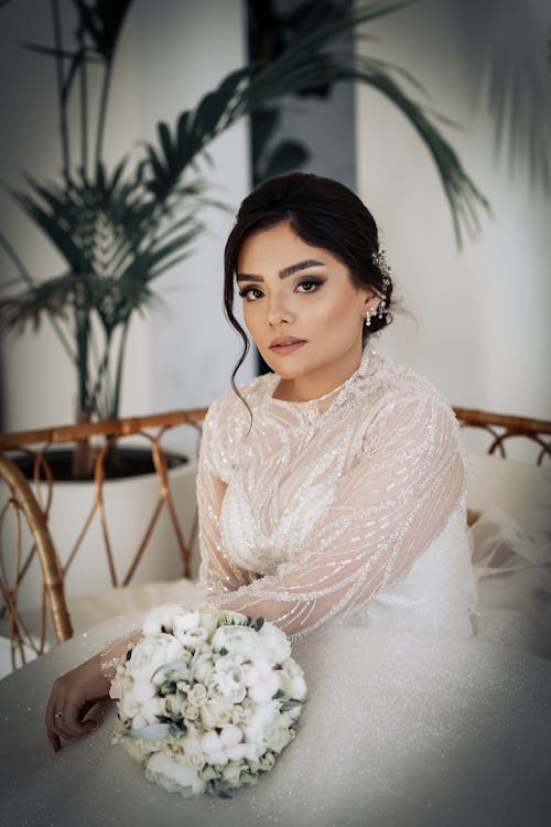 A Bride Sitting with a Bouquet 