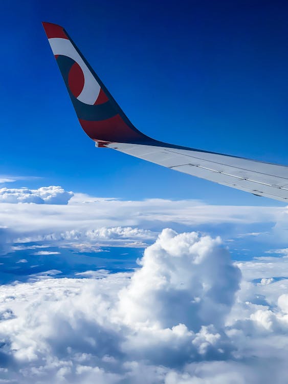 View on an Airplane Wing and Clouds 