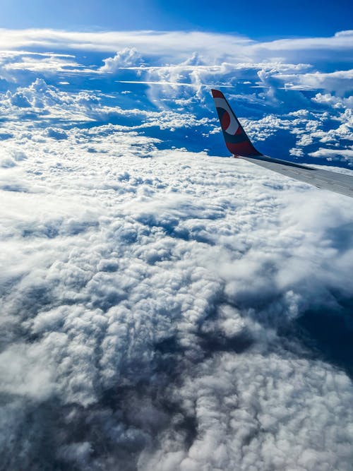 View on an Airplane Wing and Clouds 