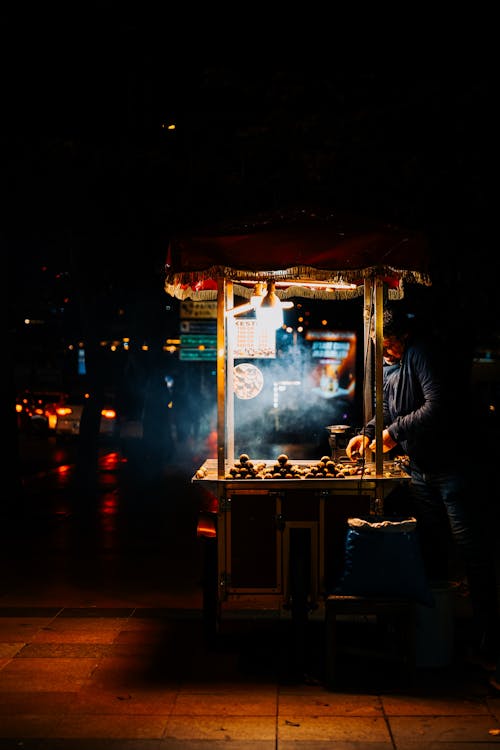 Illuminated Food Stand in the Street