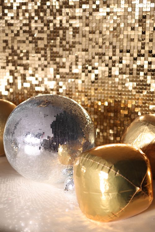 Disco ball and gold decorations for a 70’s and 80’s Retro Dance and Costume Party