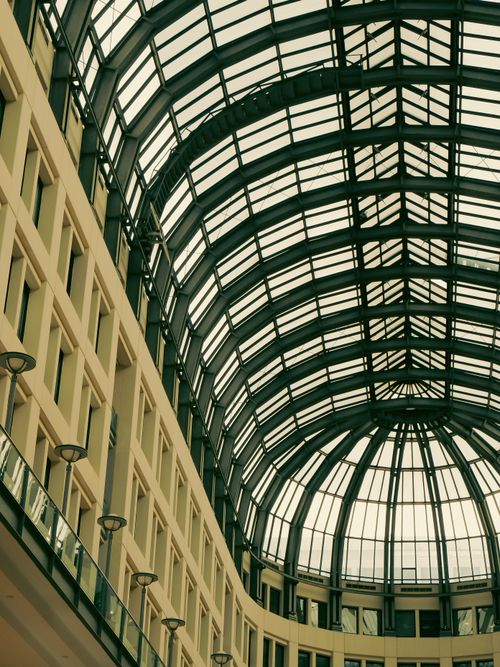 Free A striking view of the contemporary glass roof structure in an Ankara shopping mall, Türkiye. Stock Photo