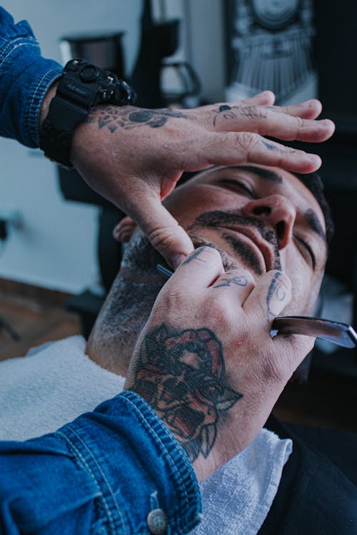 Close-up of a Man Getting His Beard Trimmed at a Barbershop