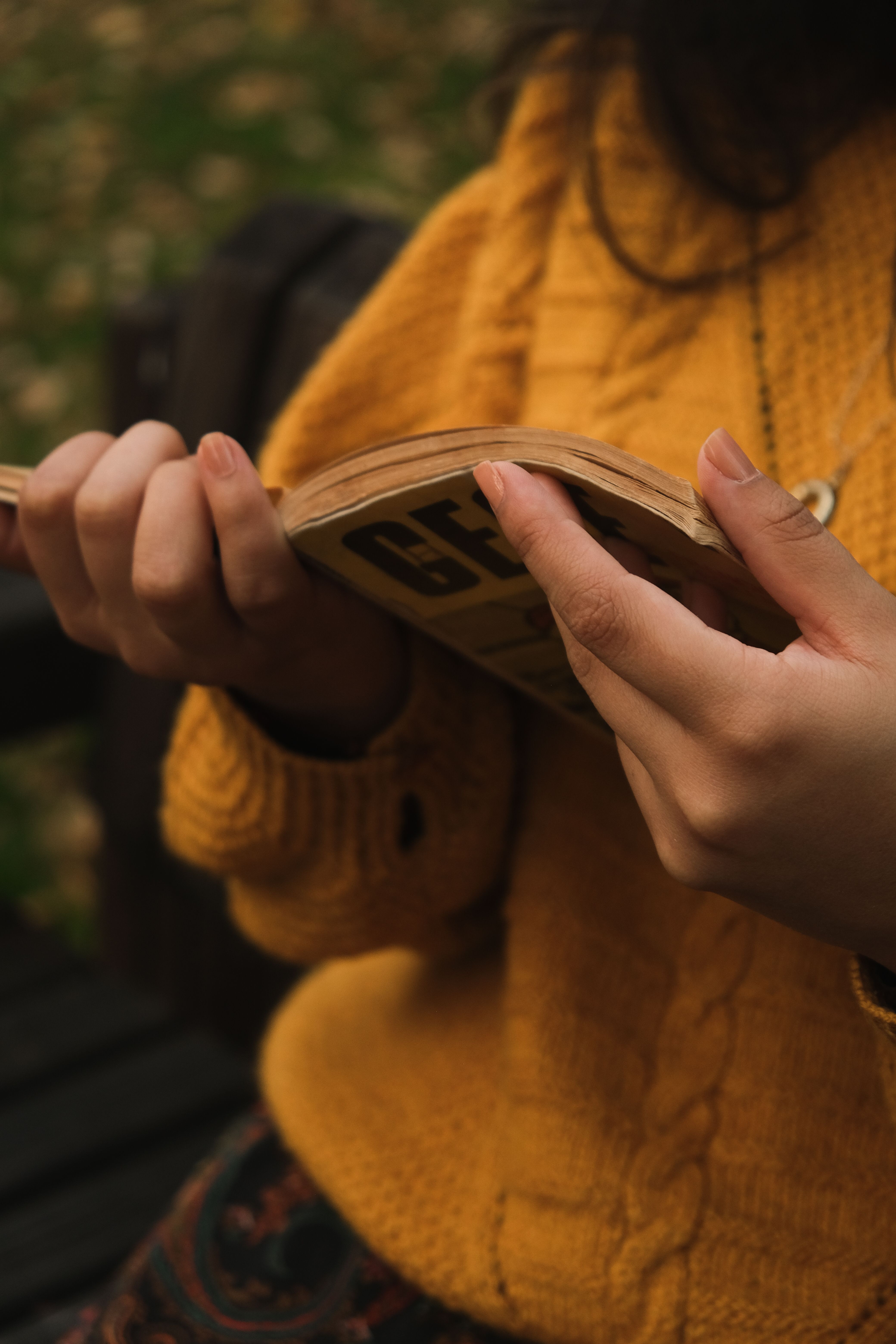Woman in a Yellow Sweater Reading a Book · Free Stock Photo