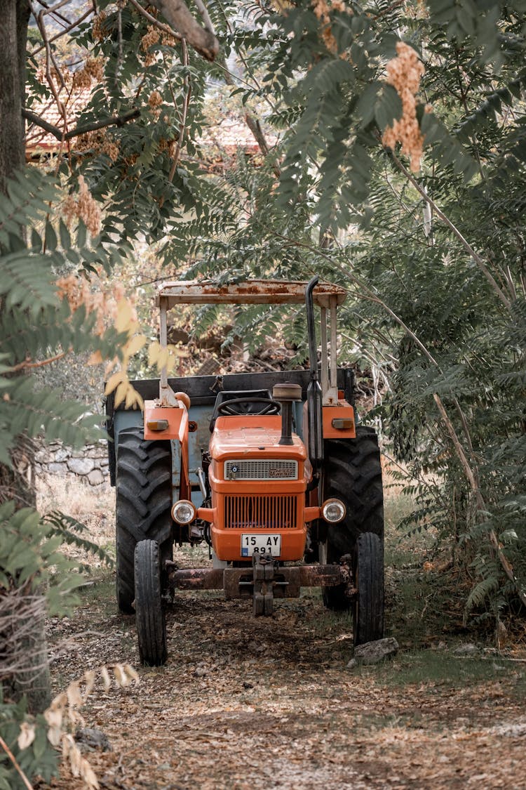 A Tractor On A Dirt Road 