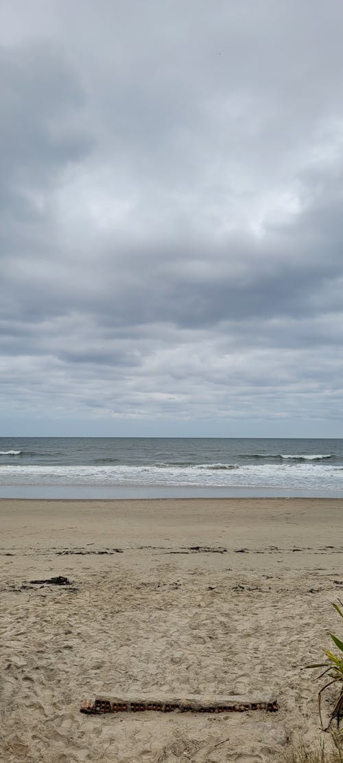 Foto profissional grátis de areia da praia, costa do oceano, mar aberto