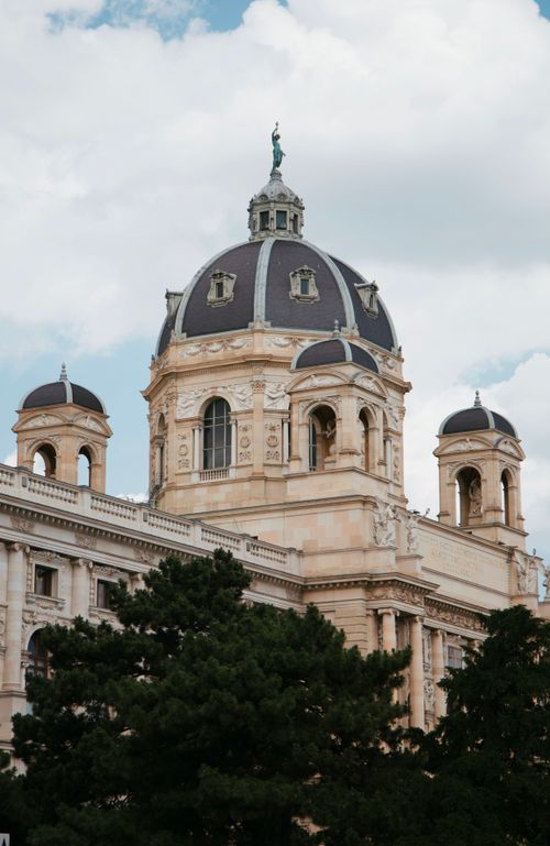 Free Beautiful baroque architecture of a museum dome in Vienna with clear skies. Stock Photo